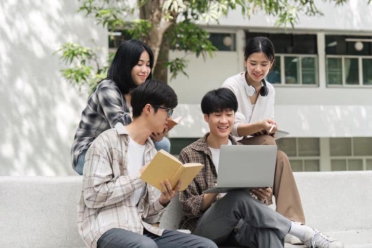 Students using an AI tutor on a laptop